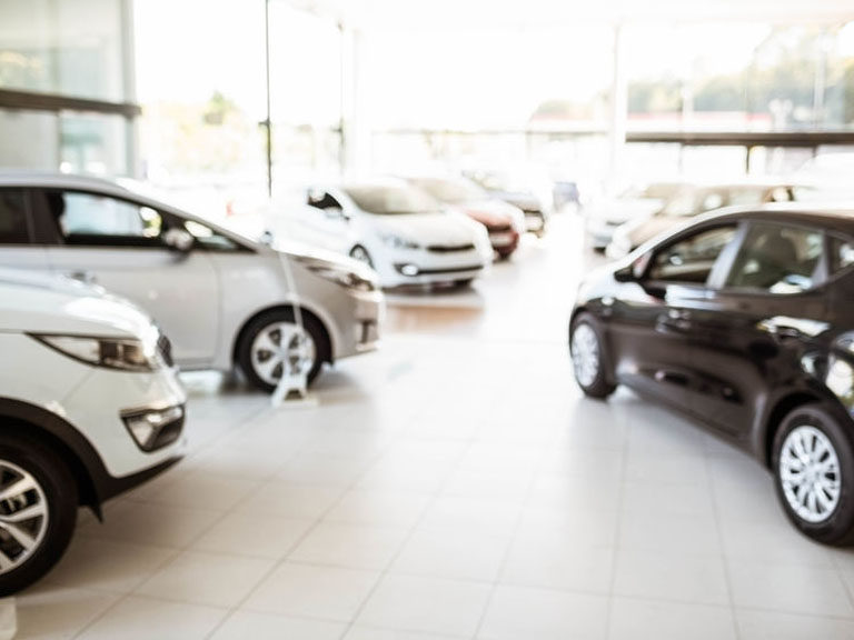 View of row new car at car dealership